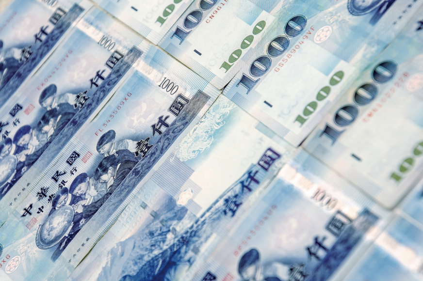 stacks of taiwan dollars cash