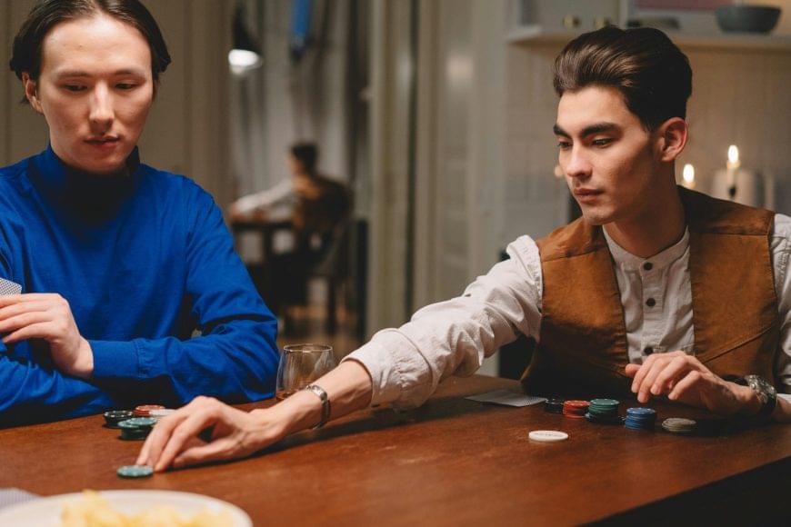 male betting poker chips in a game