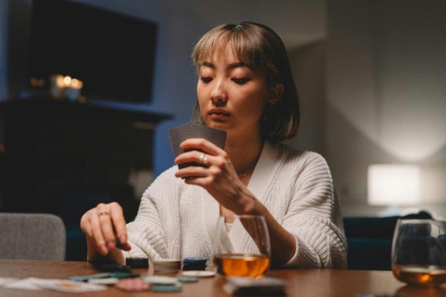 girl deciding how much to bet in a poker game